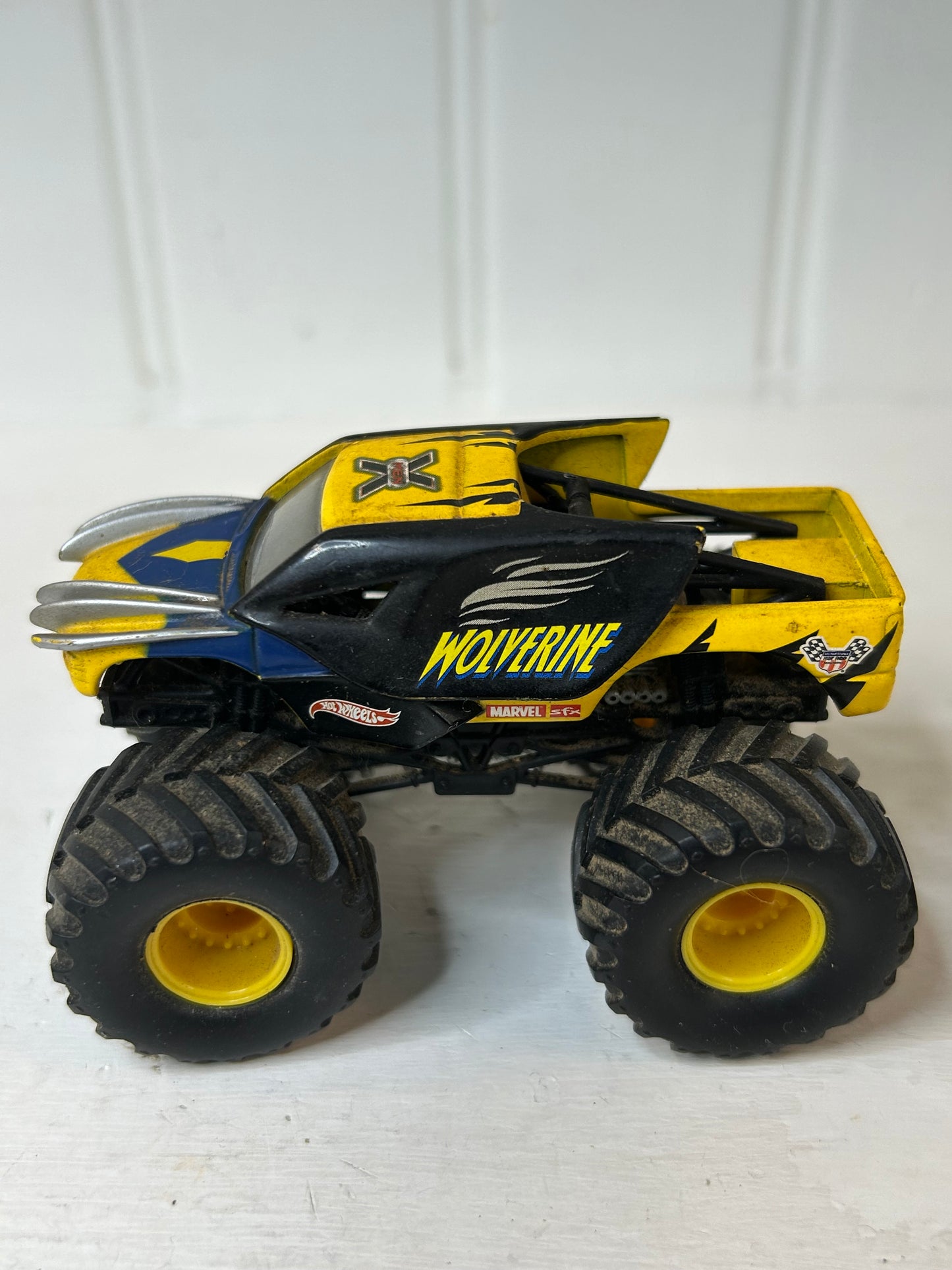 Yellow & Blue Monster Truck Toy Vehicle – X Graphic Off-Road Truck