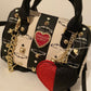 Minibolso con forma de corazón de Betsey Johnson