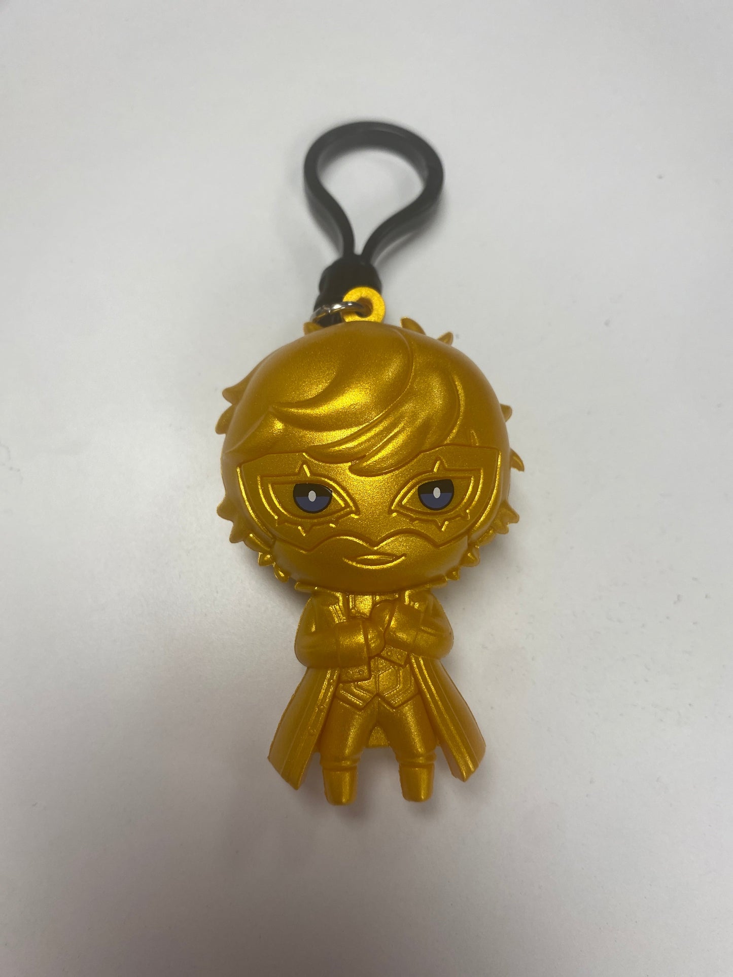 Original reference photo of the gold Joker figural bag clip on white background