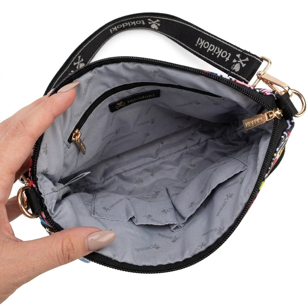 Interior view of the tokidoki crossbody bag showcasing the grey printed lining