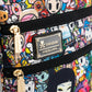 Close-up shot of gold-toned zippers and brand plaque on the tokidoki bag