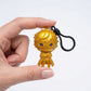 Hand holding the gold Joker figural clip to demonstrate scale and size
